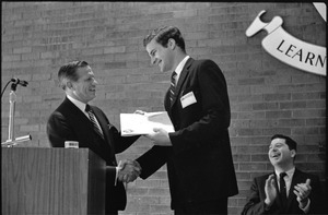 Governor Volpe and Elliot Richardson at Boston University: John Volpe shaking hands with an unidentified man