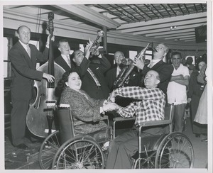 Wheelchair couple in front of band