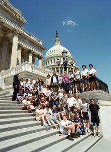 Congressman John W. Olver with group of visitors, posed on the steps of the United States Capitol building