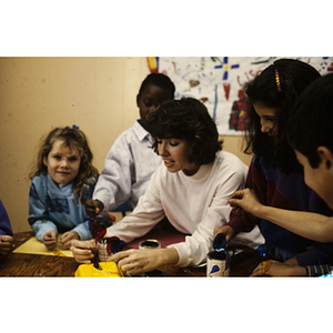Children working at a table on art projects