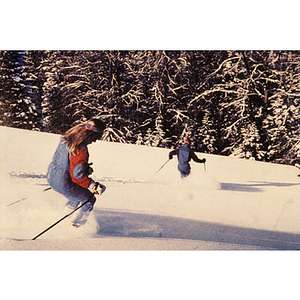 Skiers going down a slope