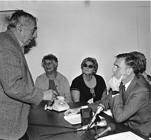 Mayor Raymond L. Flynn at table with unidentified group