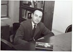 Suffolk University Professor Stanley M. Vogel (CAS) Department Chair of English, seated behind desk, photographs, circa 1960s