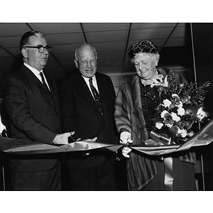 President Knowles and the Ells cut a ribbon at the dedication of the Ell Student Center addition