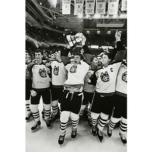 Men's hockey team celebrates after winning the Beanpot hockey championship