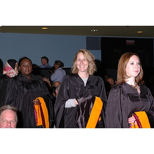 Graduates from the School of Nursing walking down the aisle to their seats during convocation