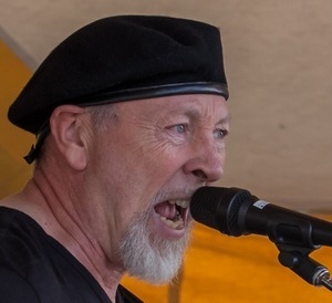 Richard Thompson: close-up portrait singing on stage at the Clearwater Festival