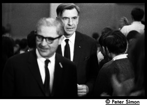 John Kenneth Galbraith (right) walking up the aisle before introducing speech by presidential candidate Eugene McCarthy at Boston University