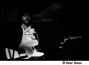The Byrds and Flying Burrito Brothers performing at the Boston Tea Party: Chris Hillman playing guitar (partial double exposure)