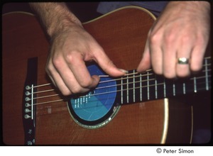 MUSE concert and rally: James Taylor's hands on his guitar, backstage at the MUSE concert