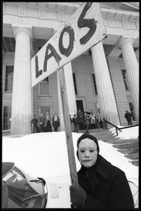 Antiwar demonstrator in mask and cloak protesting the invasion of Laos at the Vermont State House