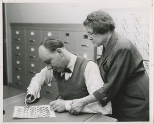 Johanna Olchewsky teaching left-hand writing to a man missing his right hand