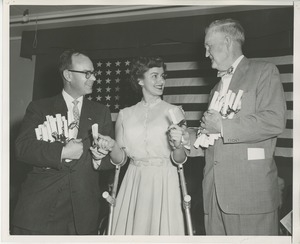 Senator Potter and Bruce Barton handing diplomas to June Trietsch at Institute Day