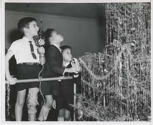 Young clients decorating Christmas tree