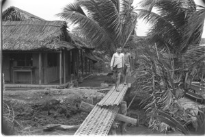 Children crossing Luong Hoa footbridge; Luong Hoa Village.