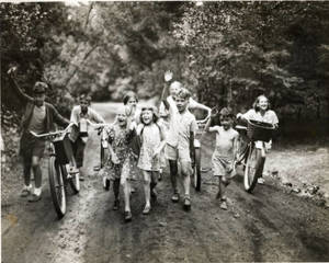 Children biking and walking at Camp Massasoit