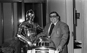 Unidentified man with R2-D2 and C-3P0 from Star Wars films at Boston City Hall