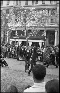 Street theater at the Vietnam Moratorium in New York: mimes in a gun fight