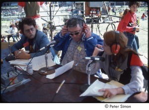 MUSE concert and rally: Danny Schechter (l) with two unidentified journalists