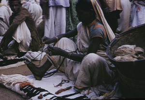 Woman preparing thread for sale in the market in Ranchi