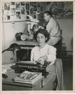 Unidentified woman at typewriter