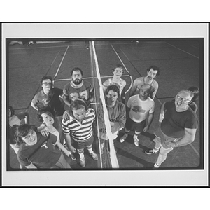 Two volleyball teams posing for a group photo