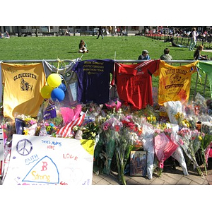 Flowers and t-shirts at Boston Marathon Copley Square memorial
