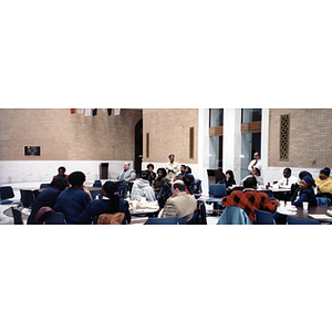 Audience members converse at a town hall meeting