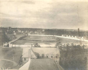 Crowd surrounding first football game on Pratt Field (1910)