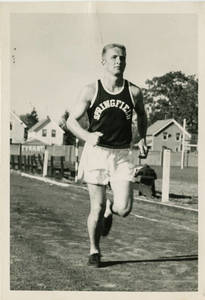 Member of track and field team running