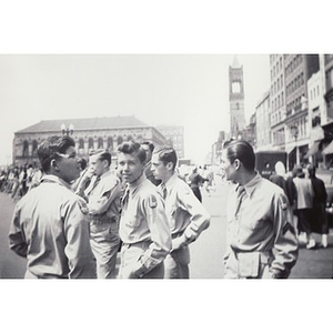 An unidentified group of Boston Latin School students loiter after the Boston School Boy Cadets parade
