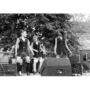 Teenage girls performing a dance on the outdoor stage at Festival Betances.
