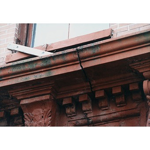 Carved lintel above the door at 326 Shawmut Avenue in disrepair.
