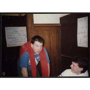 Out-of-focus photograph of two young men conversing in a room at the Charlestown Boys and Girls Club