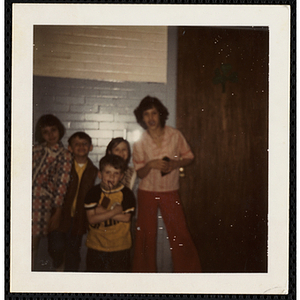 Five boys and girls posing against a wall at the South Boston Boys' Club