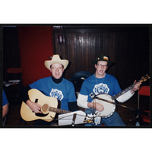 Two Bunker Hillbilly alumni play their instruments at a reunion event