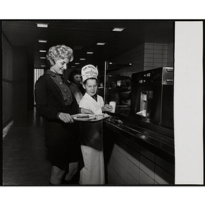 A member of the Tom Pappas Chefs' Club serves a diner in a Howard Johnson's