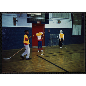 Boys play floor hockey