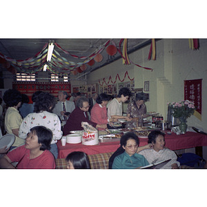 Guests eating at a Chinese Progressive Association anniversary event