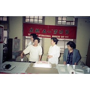 Guests and cake at an International Workers' Day event