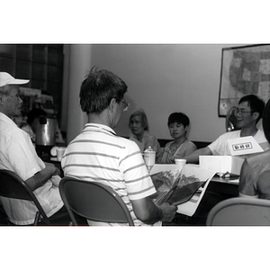 CPA members talking at a Workers' Center meeting