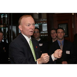 Jack Moynihan gestures while speaking to the Northeastern University