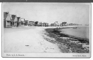 Beach with cottages and a large rowboat off shore, Brant Rock, Mass., undated