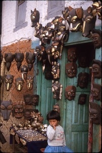 Young girl in mask shop, Bodnath