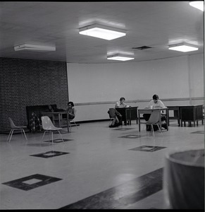 Students studying in barren room in the UMass Amherst Student Union Building