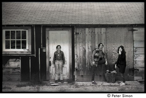 Raymond Mungo, Marty Jezer, and Michelle Clarke standing in front of an old house