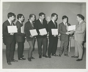 R. Mitchell presents the 1967 graduates of the Prosthetics and Orthotics training program with their certificates