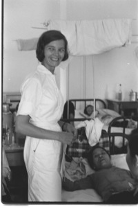 U.S. nurse Helene Hon Hart with patients. Mytho Hospital.