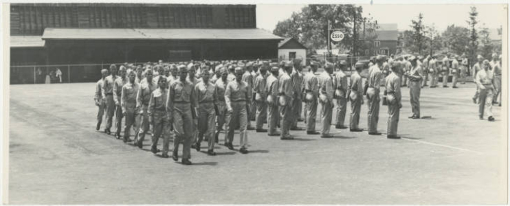 Army Air Corps marching in parking lot (May 1943)