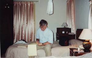 Dr. Redmond writing First Fok Physical Education and Sport Exchange Programs agreement, March, 1996